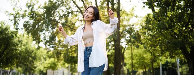 happy people carefree asian girl dancing enjoying walk park feeling happiness joy 1258 198752 SasaGotYourBack